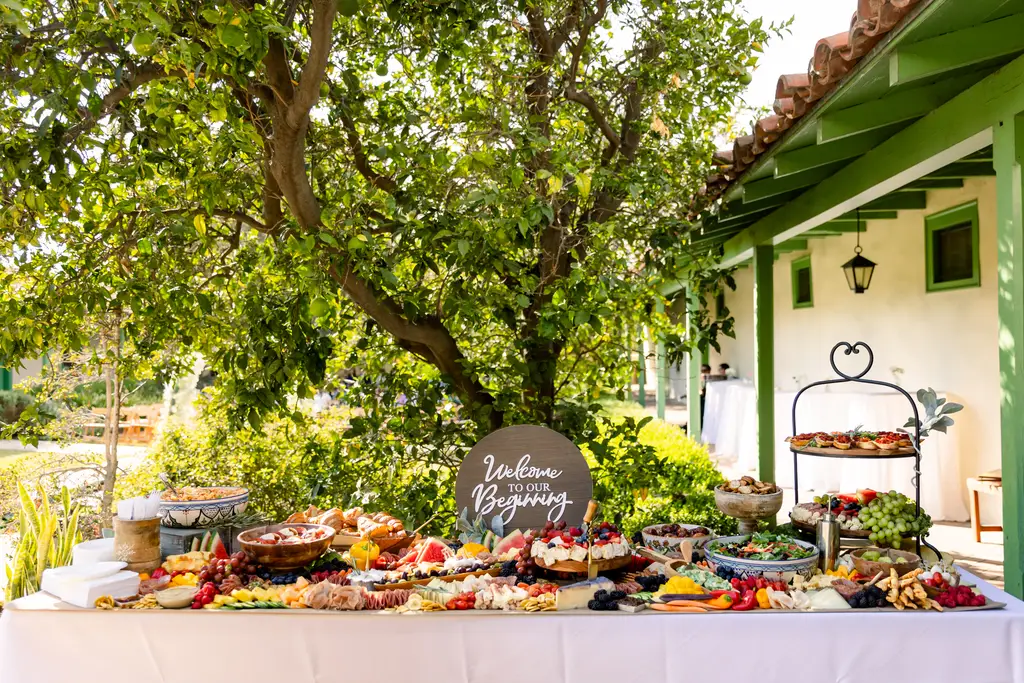 Outdoor buffet table with various foods