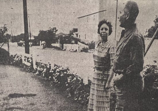 Vintage photo of two people outdoors talking.