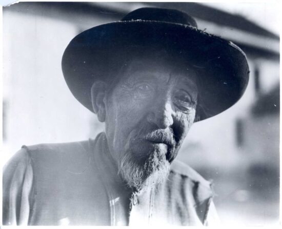 Elderly man in hat, black and white portrait