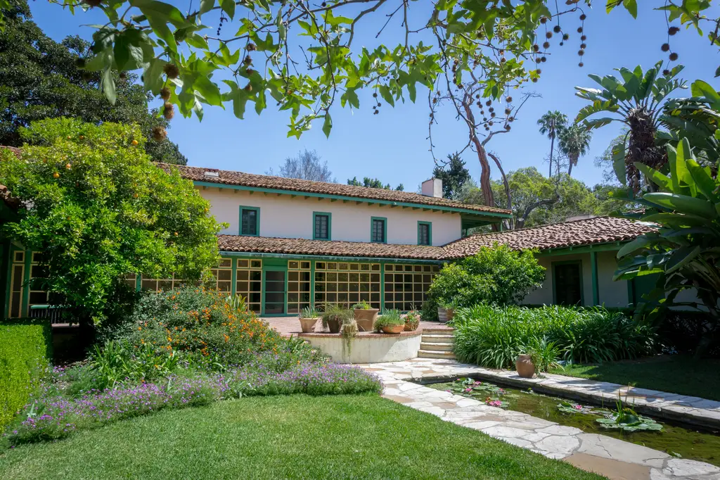 Historic Spanish-style house with lush garden.